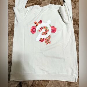 PELOTON Asian Pacific Islander DNA sweatshirt 
Size Medium Cream colored